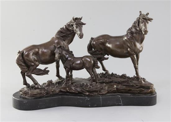 A modern bronze group of a stallion, mare and foal, length 16in.